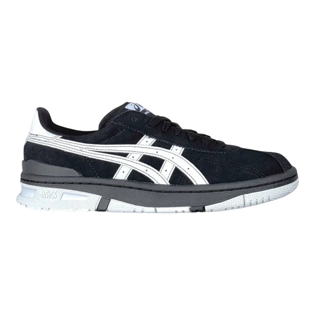 Black and white sneaker with a visible brand logo on a white background