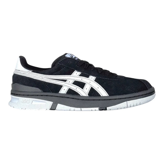 Black and white sneaker with a visible brand logo on a white background