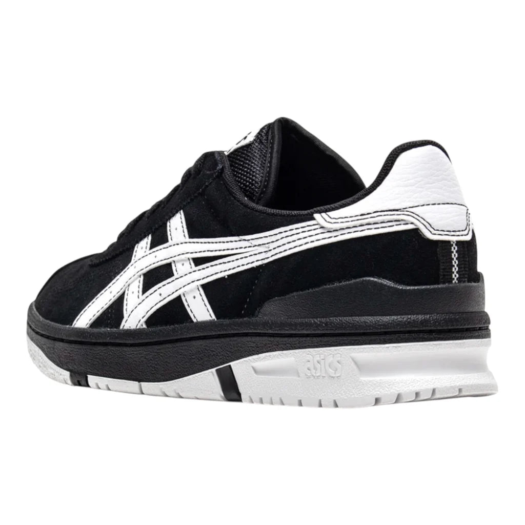 Black and white sneaker with brand logo on a white background