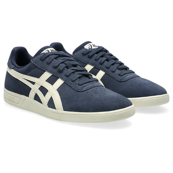 Pair of navy blue sneakers with white accents on a white background