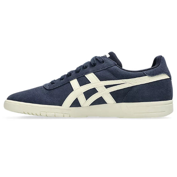Navy blue sneaker with white logo on a white background