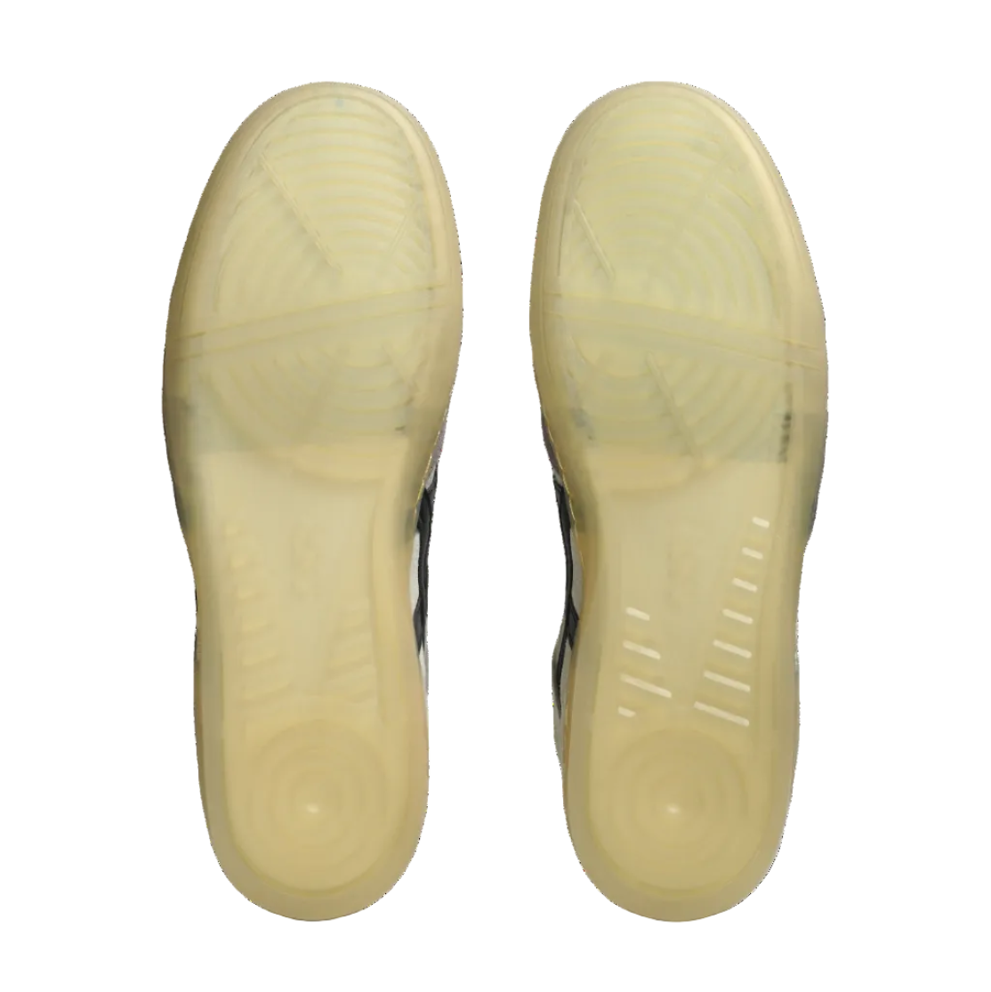 Close-up of a pair of shoes with beige soles on a white background
