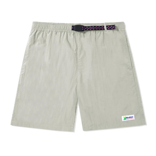 100% Nylon Shorts, Mesh Lining, Custom Pattern Woven Tape Belt With Buckle Closure, Slash Pockets On Sides, Single Patch Pocket On Back, Woven Label On Leg, Shorter Cut, Sits Above The Knee. Butter Goods Equipment Shorts Stone