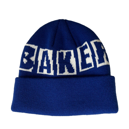 A royal blue knit beanie with a folded cuff and the word 'BAKER' knitted across the top in large white varsity-style letters, shown on a plain white background.
