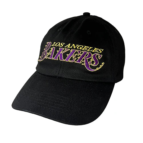 A black Los Angeles Bakers baseball cap featuring embroidered lettering in purple and gold on the front, set against a plain white background.