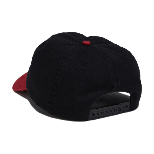 A black baseball cap with a red visor and a red button on top, shown from a rear three-quarter angle against a white background.
