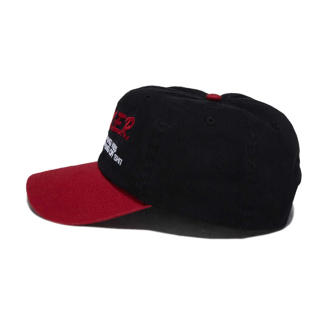 A black baseball cap with a red curved brim, featuring red and white embroidered text on the front side.