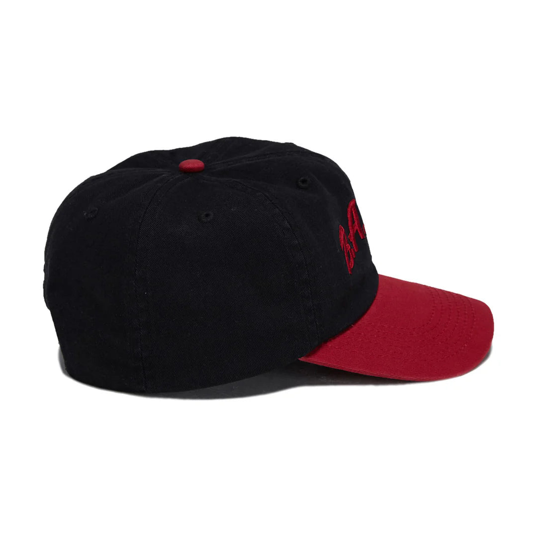 A black baseball cap with a red visor and red embroidered logo on the side, shown against a plain white background.