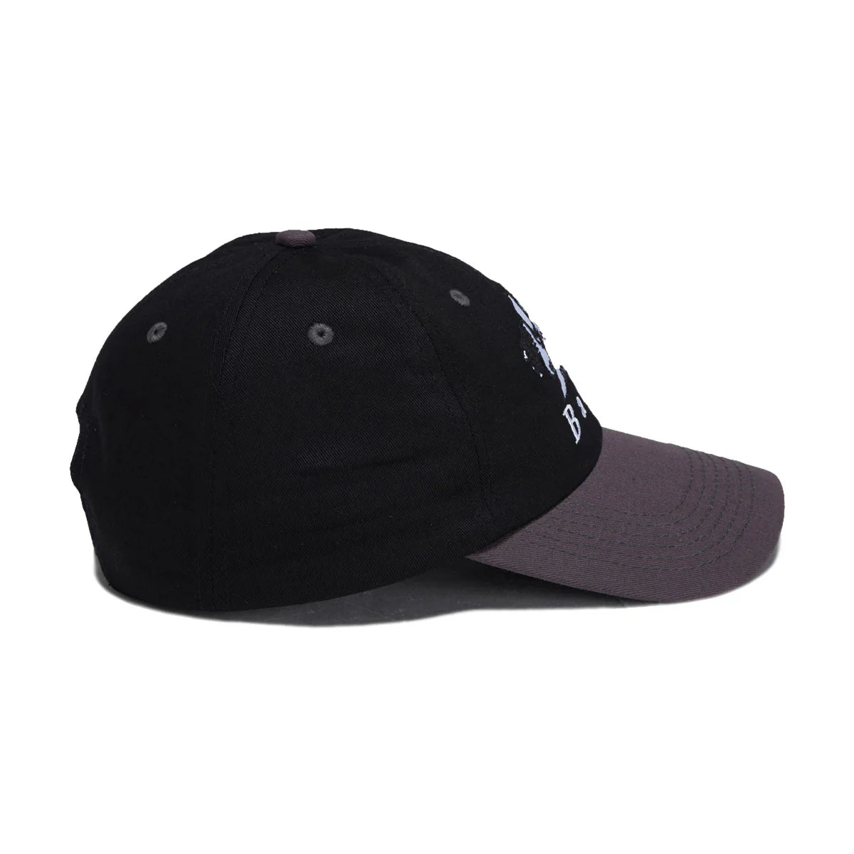 A black baseball cap with a dark gray visor, featuring a small white graphic on the side, shown against a plain white background.