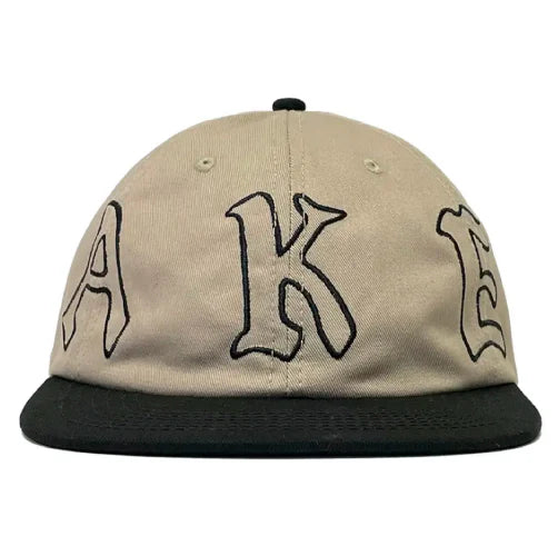 Beige cap with black text on a white background