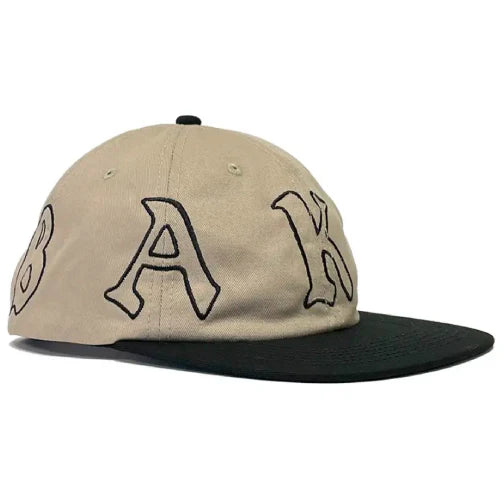 Beige cap with black text on a white background