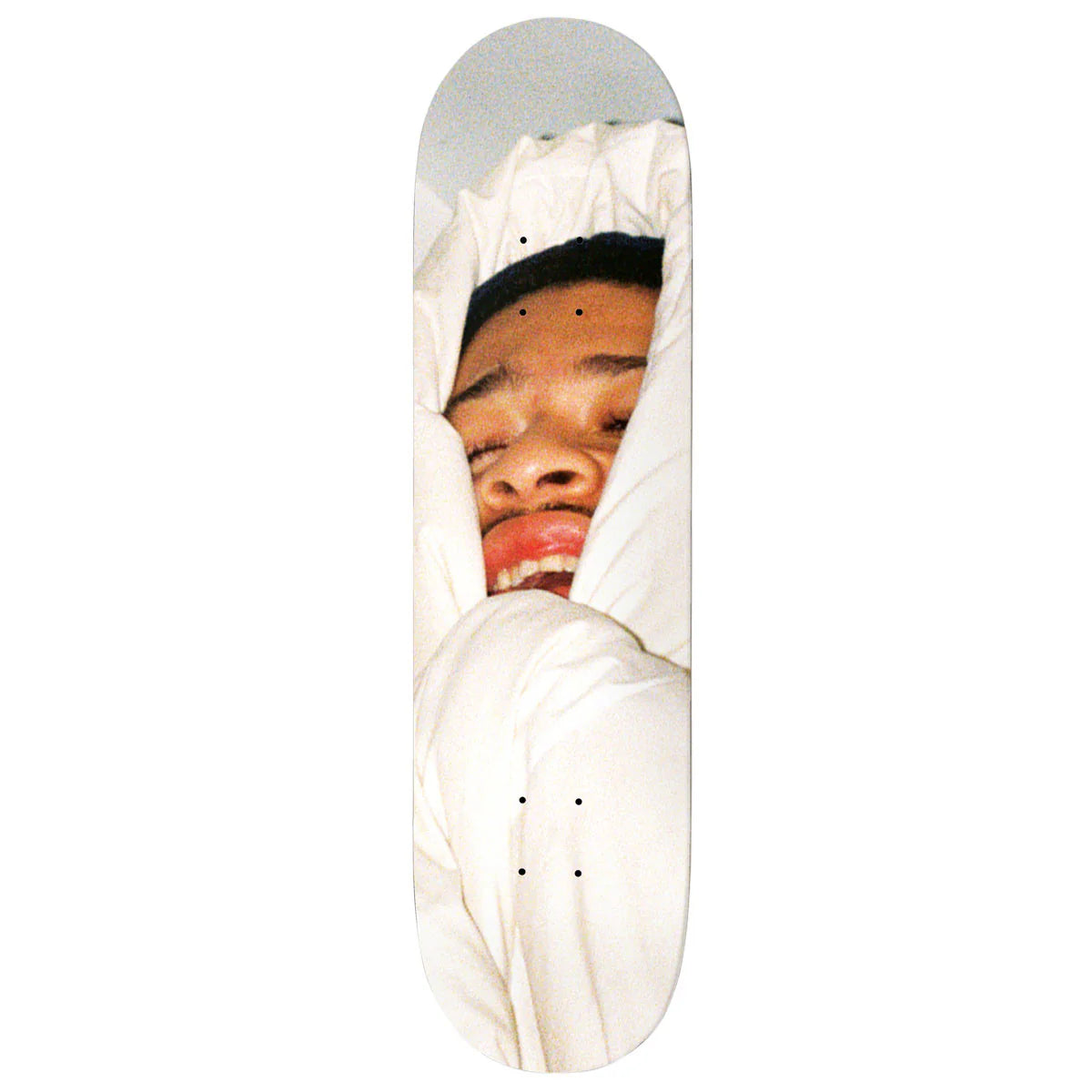 Skateboard deck with a person's face peeking out from a white blanket on a white background