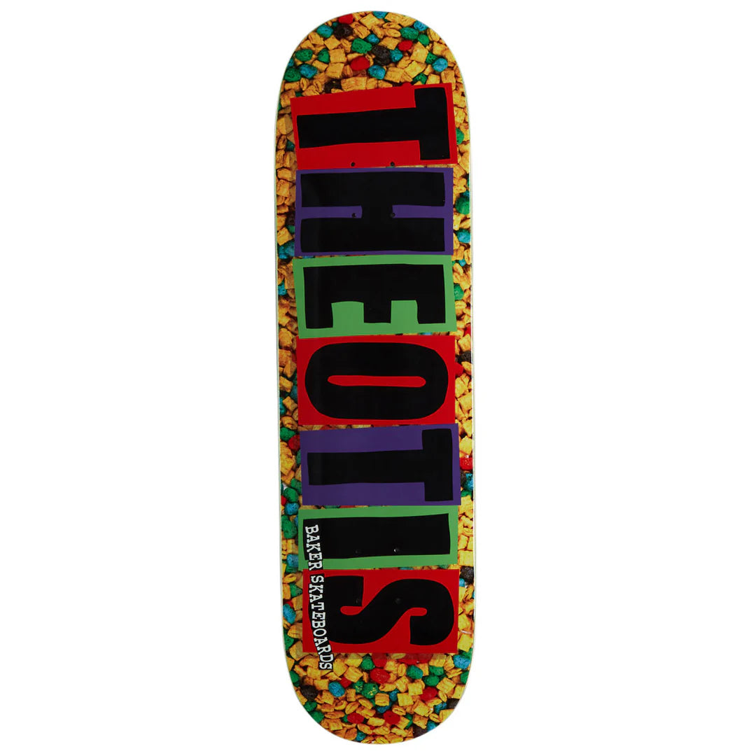 A skateboard deck shown vertically against a plain white background. The deck features a colorful, multicolor confetti pattern around the edges and a large, bold vertical text graphic spelling 'THE OTS' in black, red, green, and purple blocks.