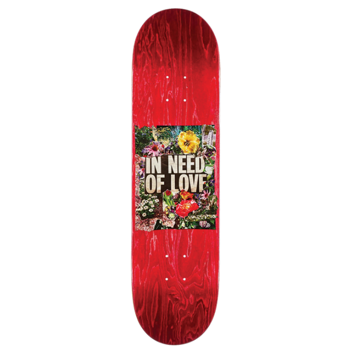 Red skateboard deck with a colorful graphic and text on a white background