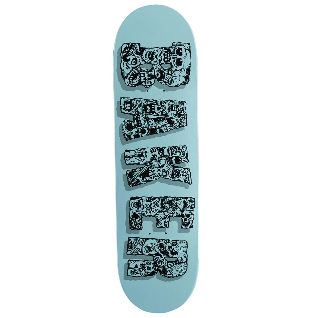 A light blue skateboard deck featuring the word 'SKATE' printed vertically in large black letters filled with detailed skull and face illustrations, shown against a plain white background.