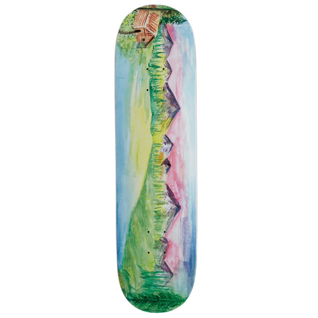 A skateboard deck featuring a colorful, artistic landscape illustration with green hills, pink and blue sky, and a small cabin at the top, shown against a plain white background.