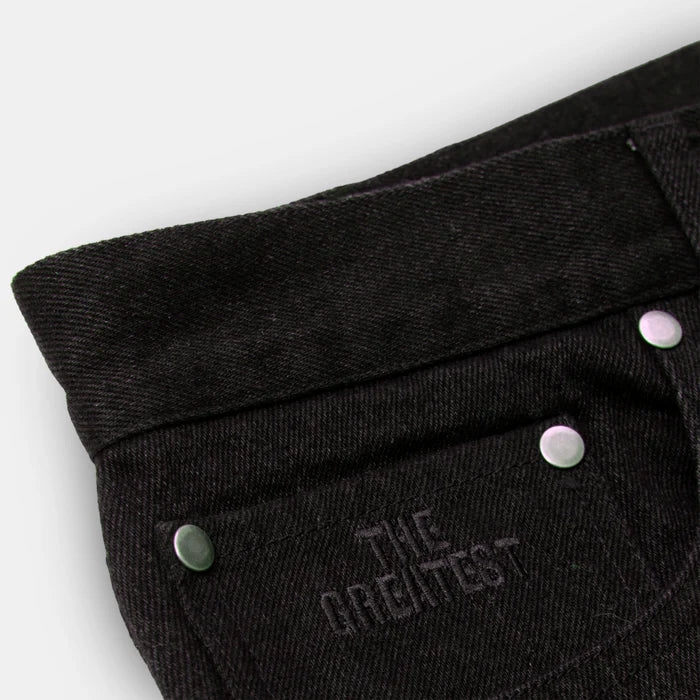Black pants with 'The Greatest' embroidery on a white background