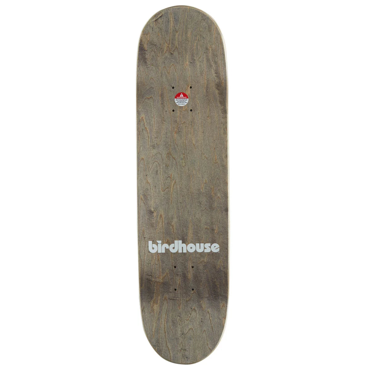 A Birdhouse skateboard deck with a weathered brown wood grain finish, featuring the white 'birdhouse' logo near the bottom and a small red and white graphic near the trucks.