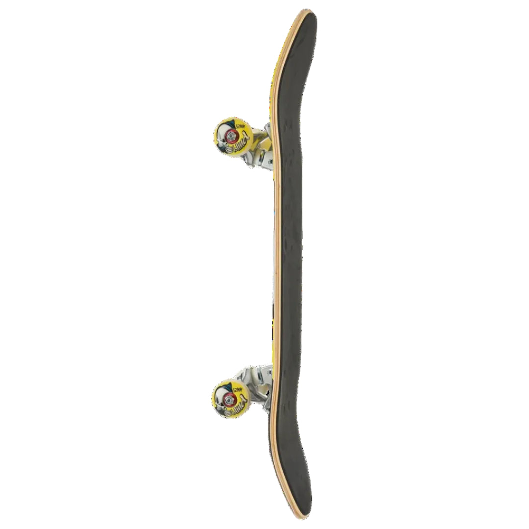 A skateboard shown vertically from the side against a solid white background, featuring a black grip tape deck, natural wood edges, and yellow wheels with multicolor graphics.