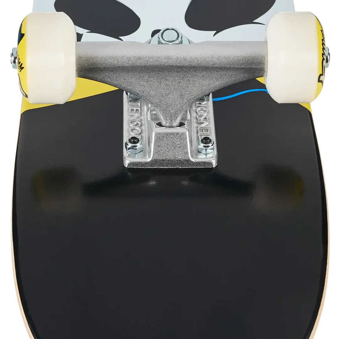 Close-up rear view of a skateboard showing the black deck, silver trucks, cream wheels, and a light blue graphic with black shapes on the underside.
