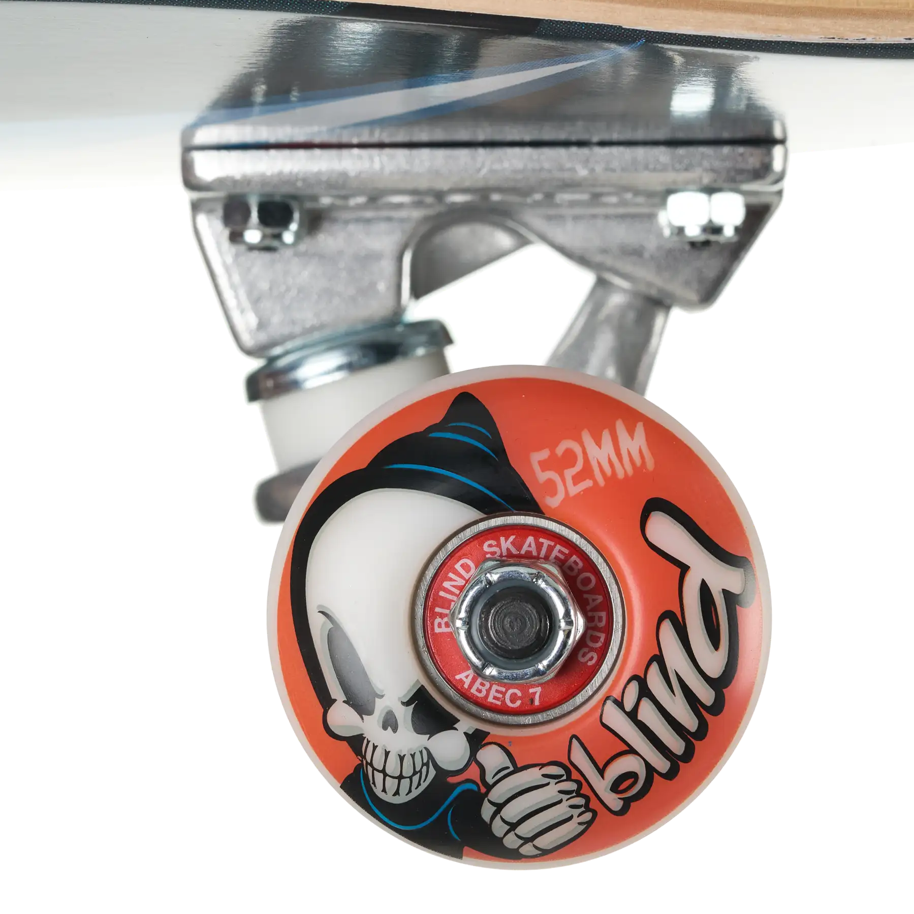 Close-up of a skateboard wheel and truck assembly on a white background. The wheel is orange with a cartoon skull graphic, black script text reading 'blind', and a red center ring that says 'RUMSK SKATE CO.