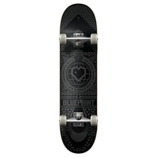 A skateboard shown from the underside, featuring a black deck with a detailed gray circular emblem and the word 'BLUEPRINT' near the tail, mounted on silver wheels against a light gray background.
