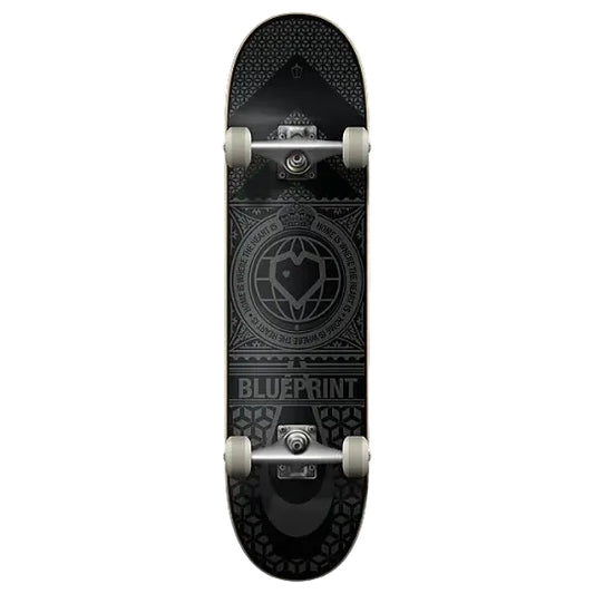 A skateboard shown from the underside, featuring a black deck with a detailed gray circular emblem and the word 'BLUEPRINT' near the tail, mounted on silver wheels against a light gray background.
