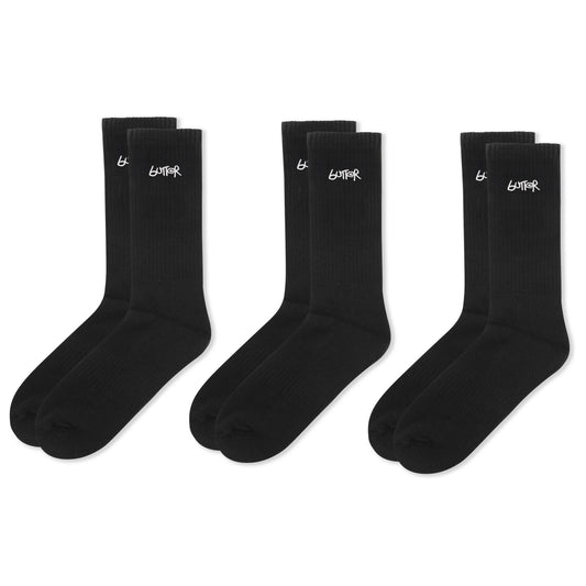 Three pairs of black socks with a logo on a white background