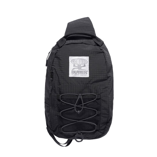 Black sling bag with a visible brand logo on a white background