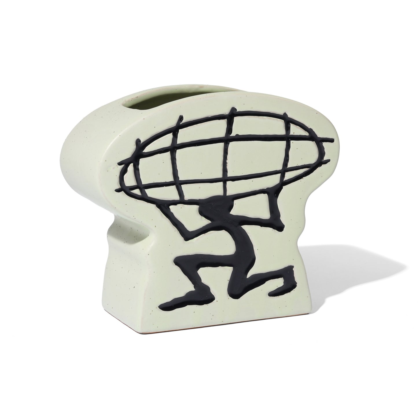 Ceramic planter with black silhouette of a person carrying a globe on a white background