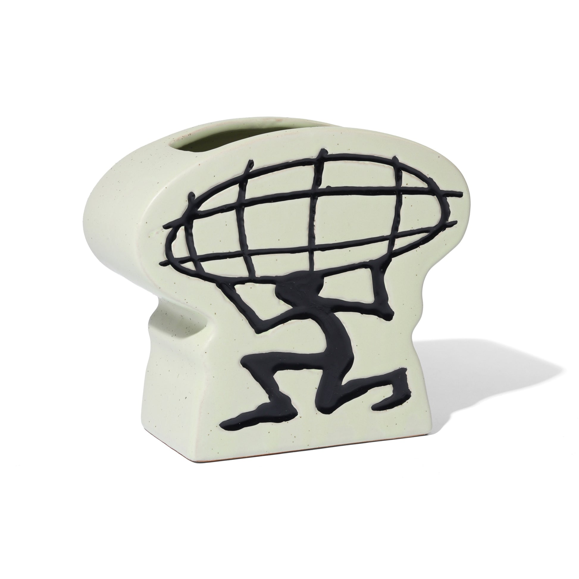 Ceramic planter with black silhouette of a person carrying a globe on a white background