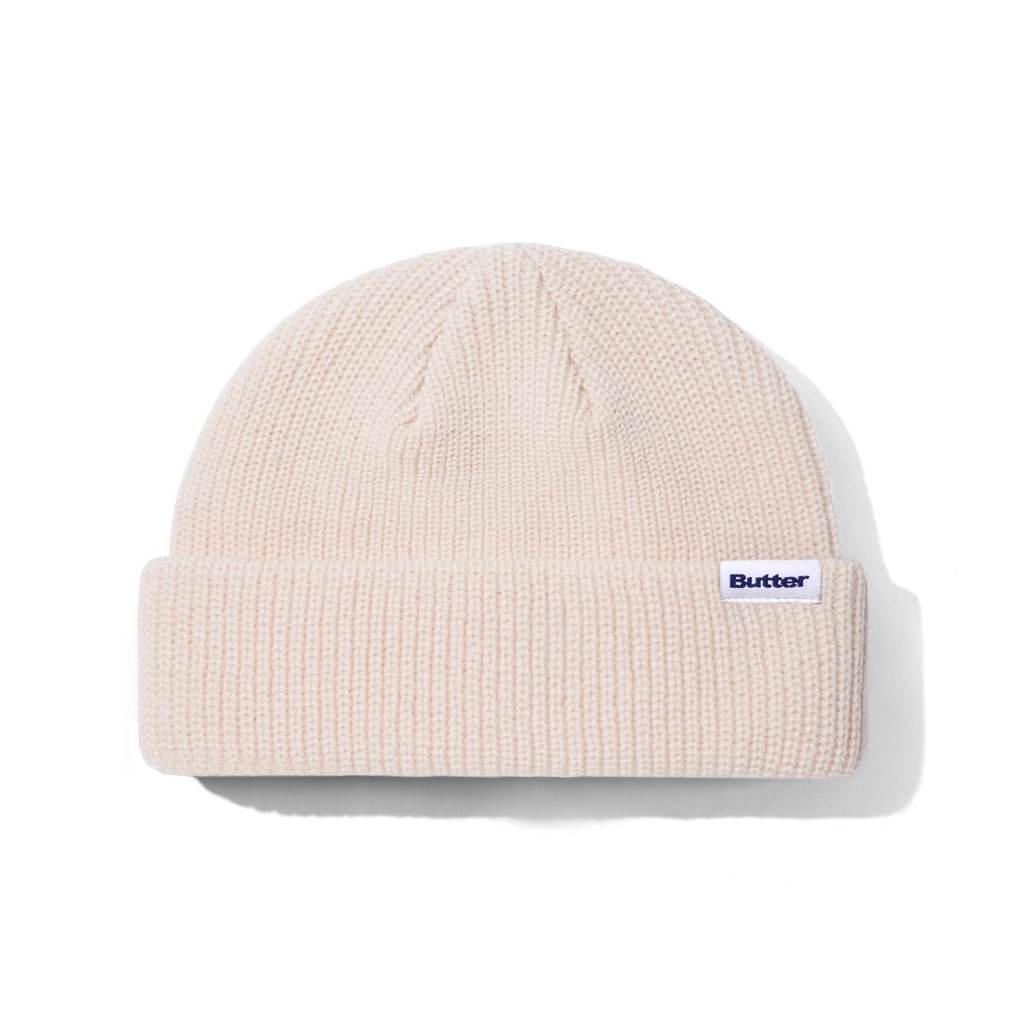 Beige knit beanie with a brand logo on a white background