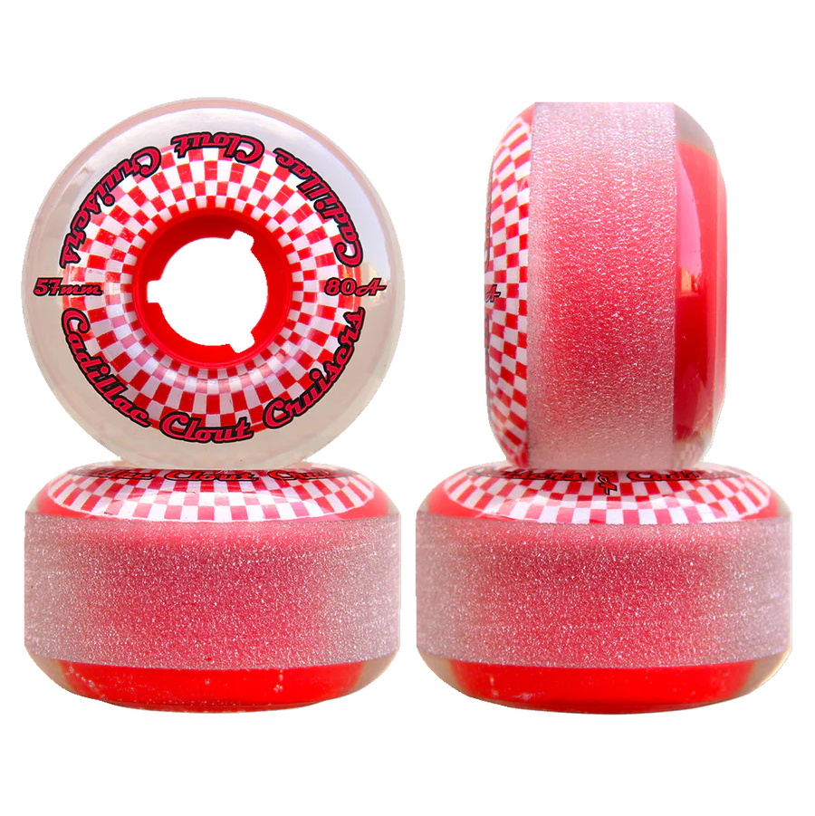 Four red and white checkered skateboard wheels on a white background