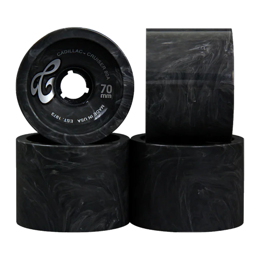 Four black skateboard wheels with visible branding on a white background