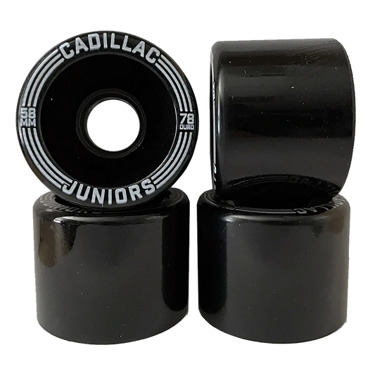 Black skateboard wheels with 'Cadillac Juniors' branding on a white background