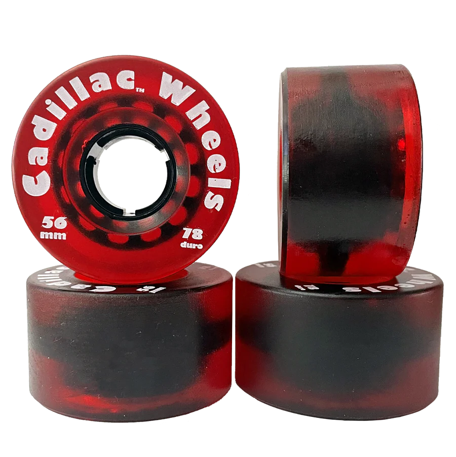 Red and black skateboard wheels with 'Cadillac Wheels' branding on a white background