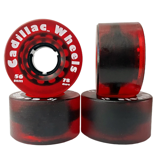 Red and black skateboard wheels with 'Cadillac Wheels' branding on a white background