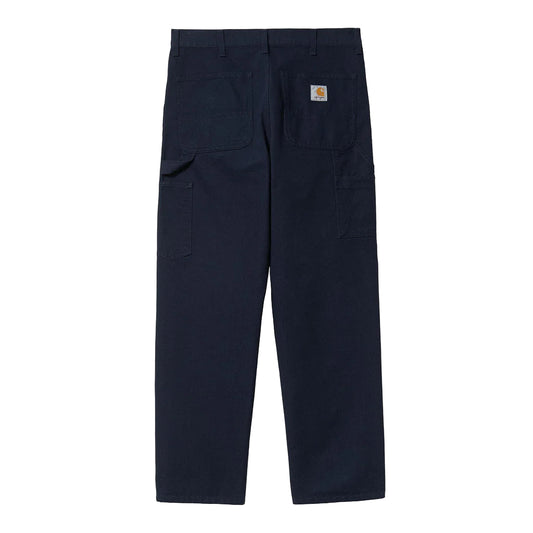 Navy blue pants with a brand logo on a white background