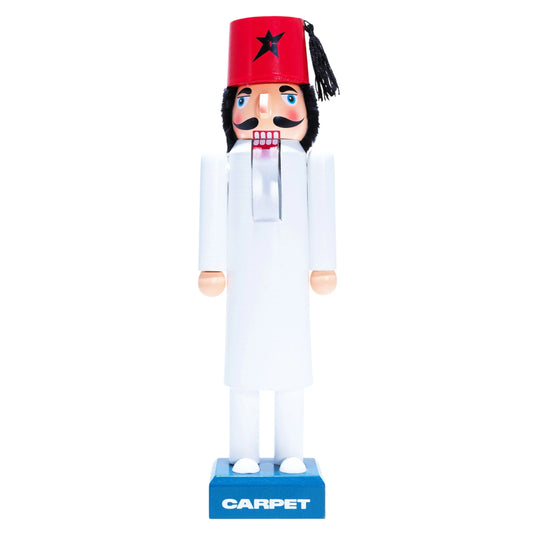 Nutcracker figure with a red hat and white outfit on a white background