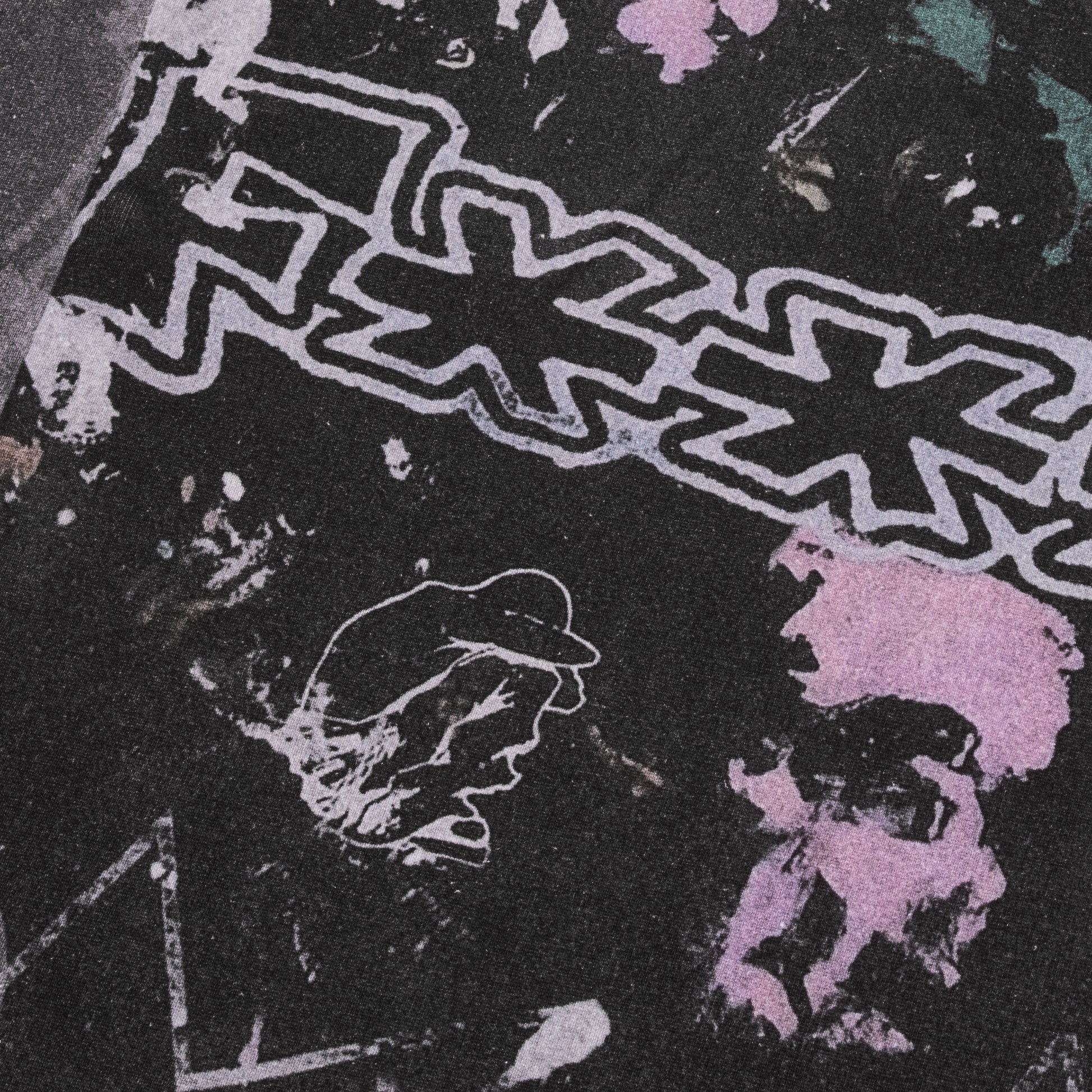 Close-up of a graphic design with abstract shapes and text on a dark background