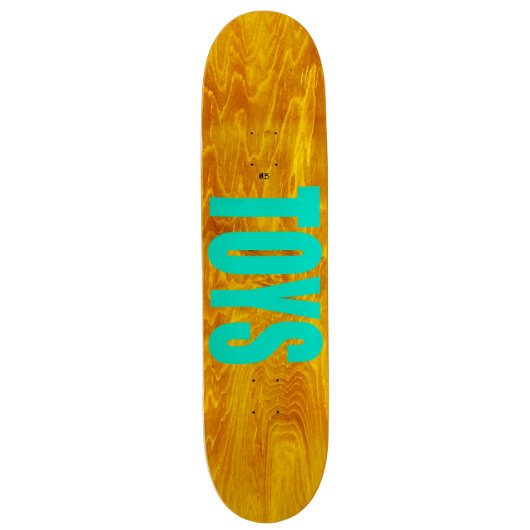 Skateboard deck with 'TOYS' text on a wooden pattern background