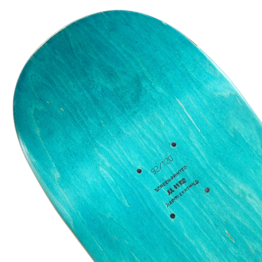 Teal skateboard deck with text on a white background
