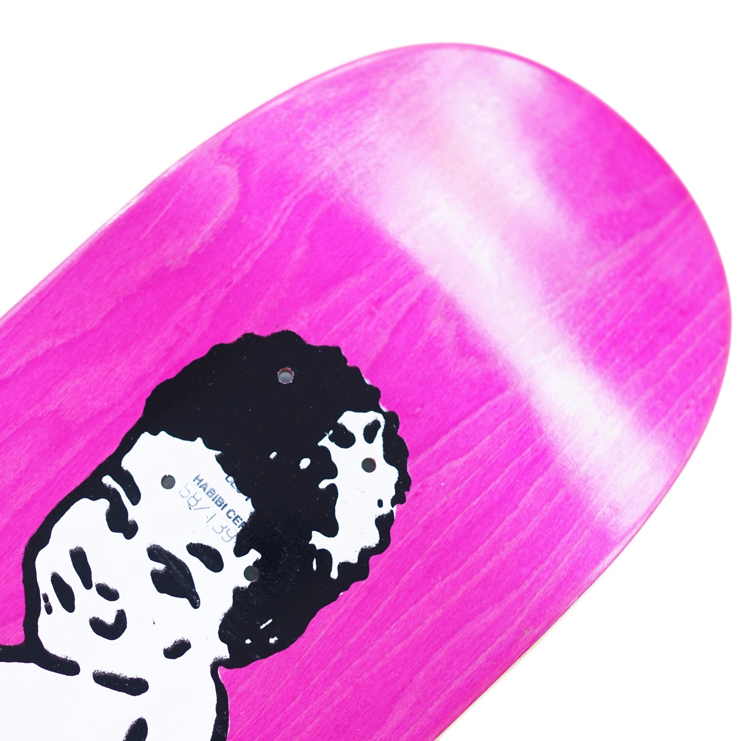 Skateboard deck with pink and white design and black and white graphic on a white background