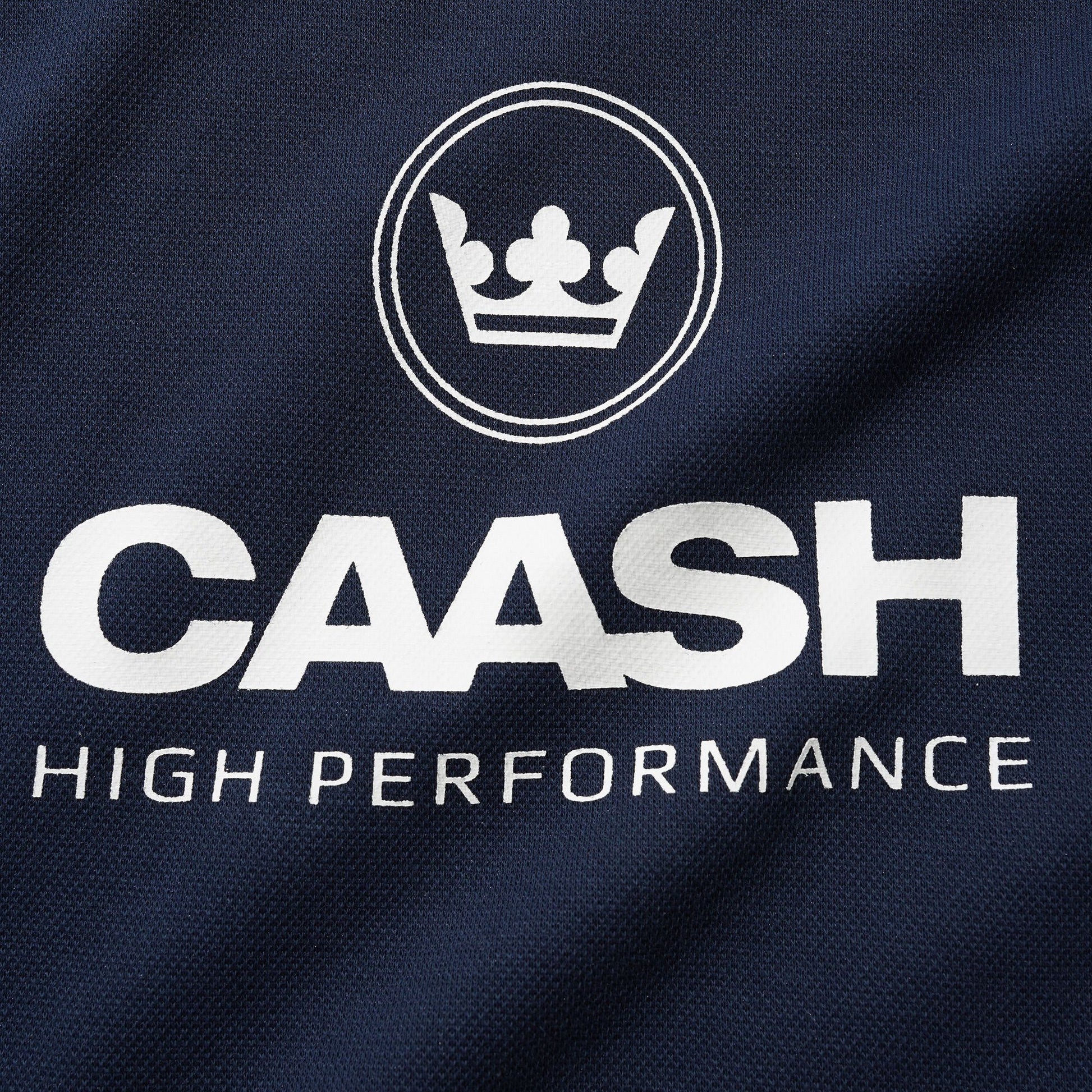 CAASH High Performance logo on a dark blue fabric background