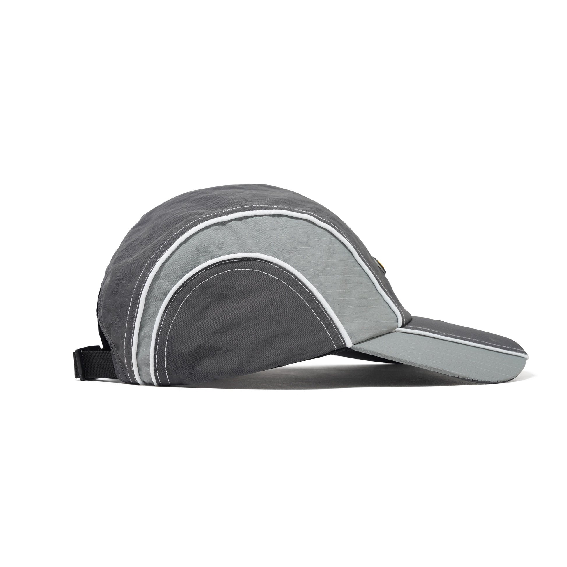 Gray visor cap with white accents on a white background