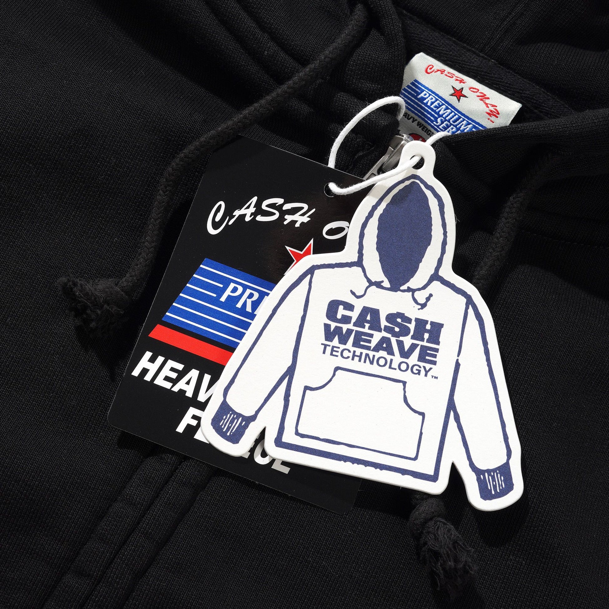 Black hoodie with a brand tag on a black background