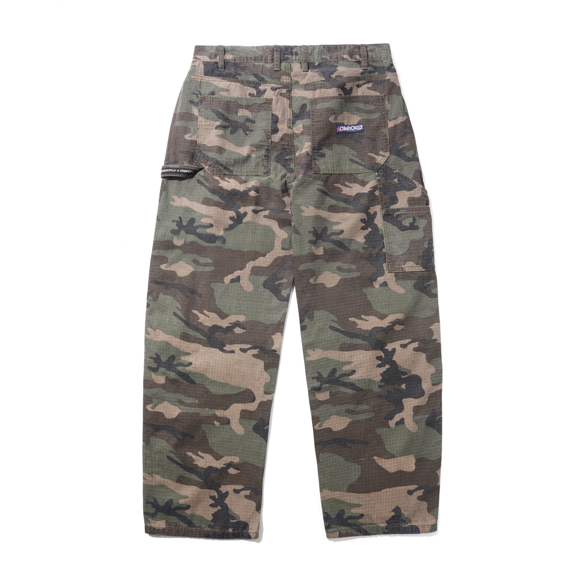 A pair of Patagonia camouflage cargo pants shown flat against a solid white background. The pants feature a classic woodland camo pattern in shades of green, brown, and beige, with a small blue Patagonia logo patch on the upper right hip.