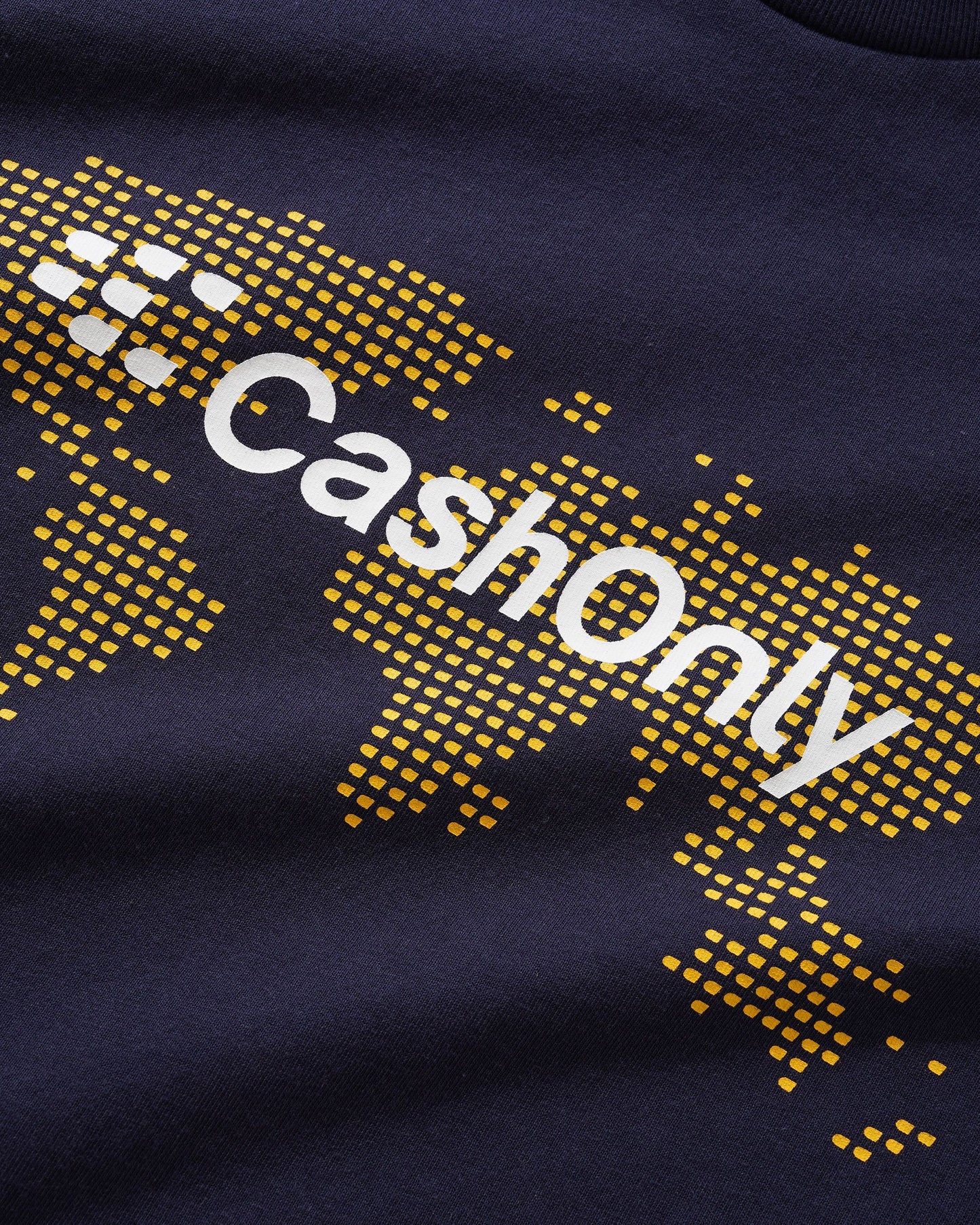 Navy blue fabric with 'CashOnly' text in white and yellow pattern