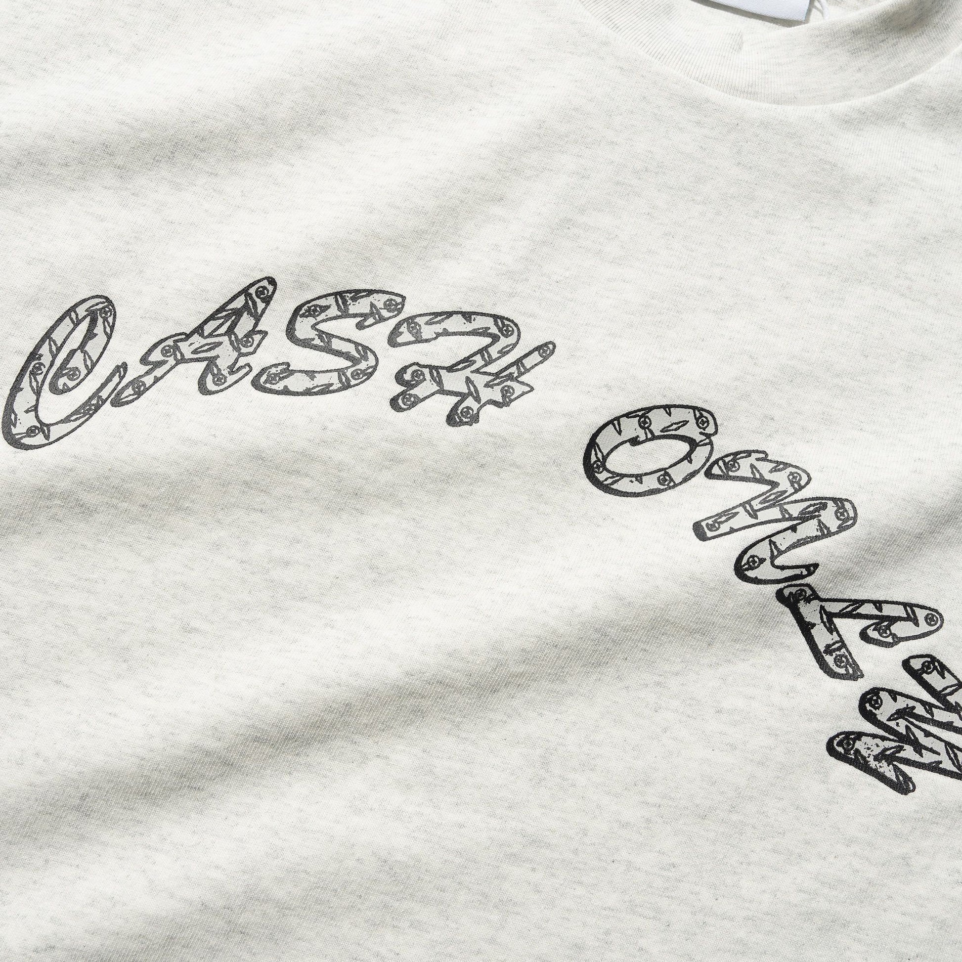 Grey sweatshirt with black text and a visible brand logo on a white background