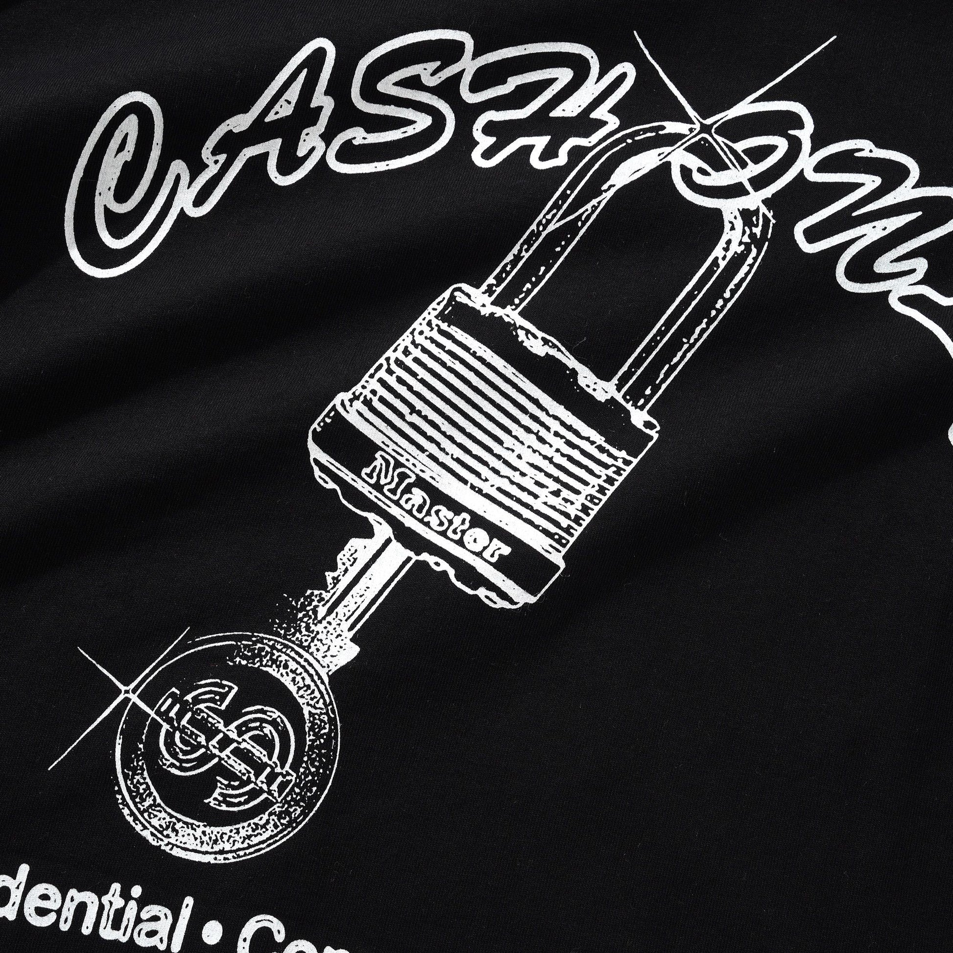 Black shirt with white graphic of a padlock and key, and text on a dark background